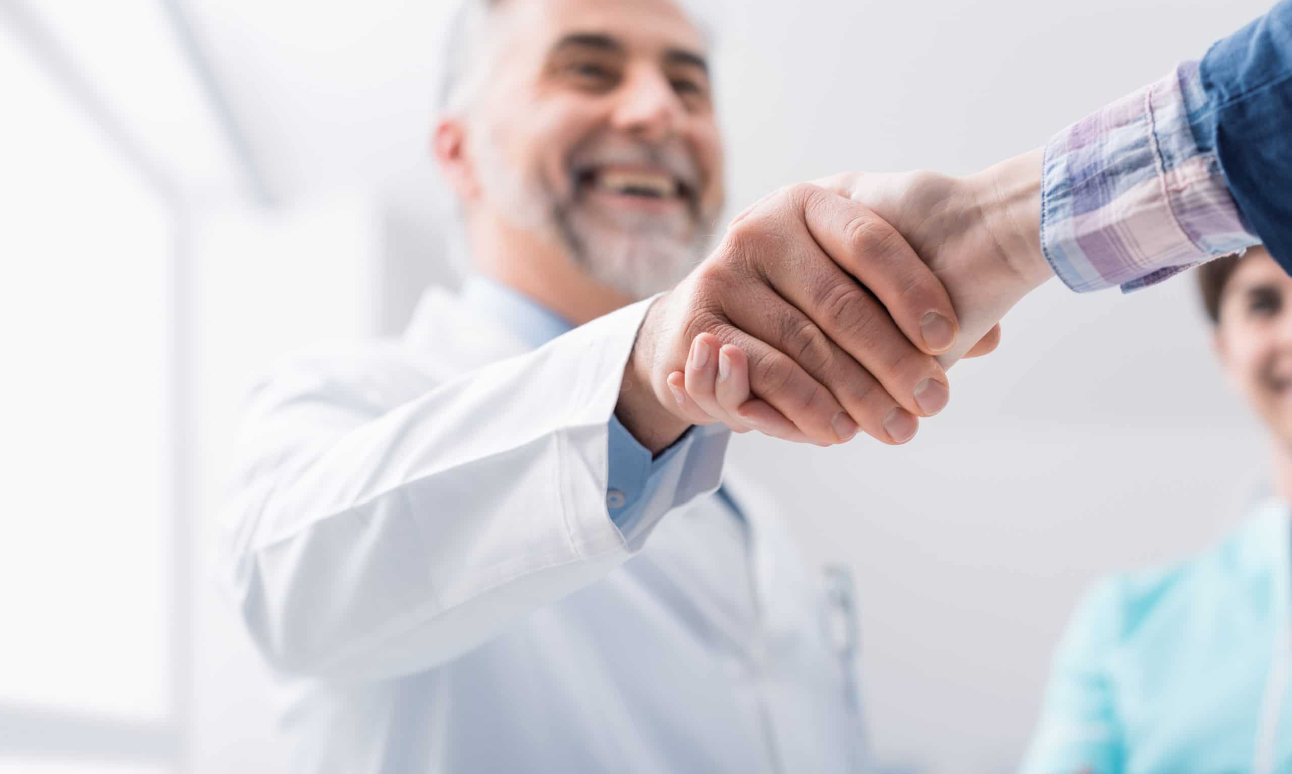 Doctor shaking his patient's hand