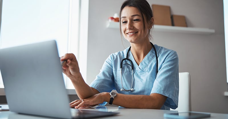 Doctor monitoring patient data remotely using AI-powered RPM technology